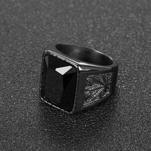 Black stone cocktail / signet ring. For proper gents about town, innit.