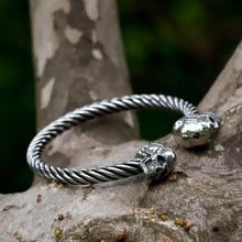 Yeah, it's a stainless steel skull bangle. Who's asking?