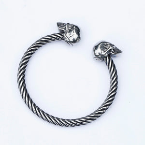 Yeah, it's a stainless steel skull bangle. Who's asking?