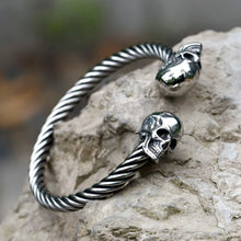 Yeah, it's a stainless steel skull bangle. Who's asking?