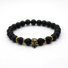 Gold or silver skull bracelet. Black lava stone beads. Nice one.